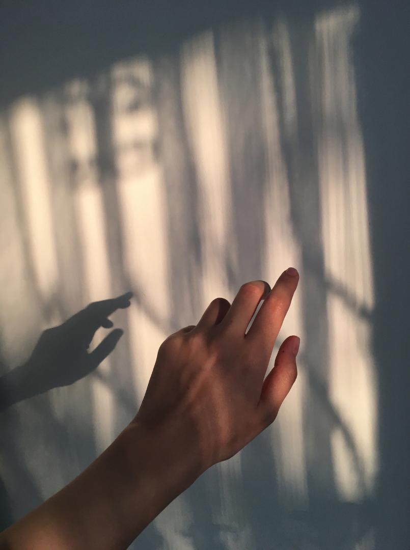 hand in light shadow reflection