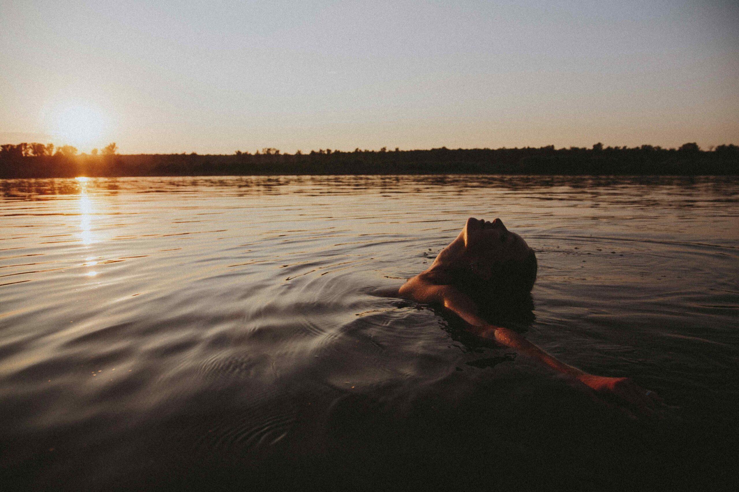 woman freely floating in the sea.