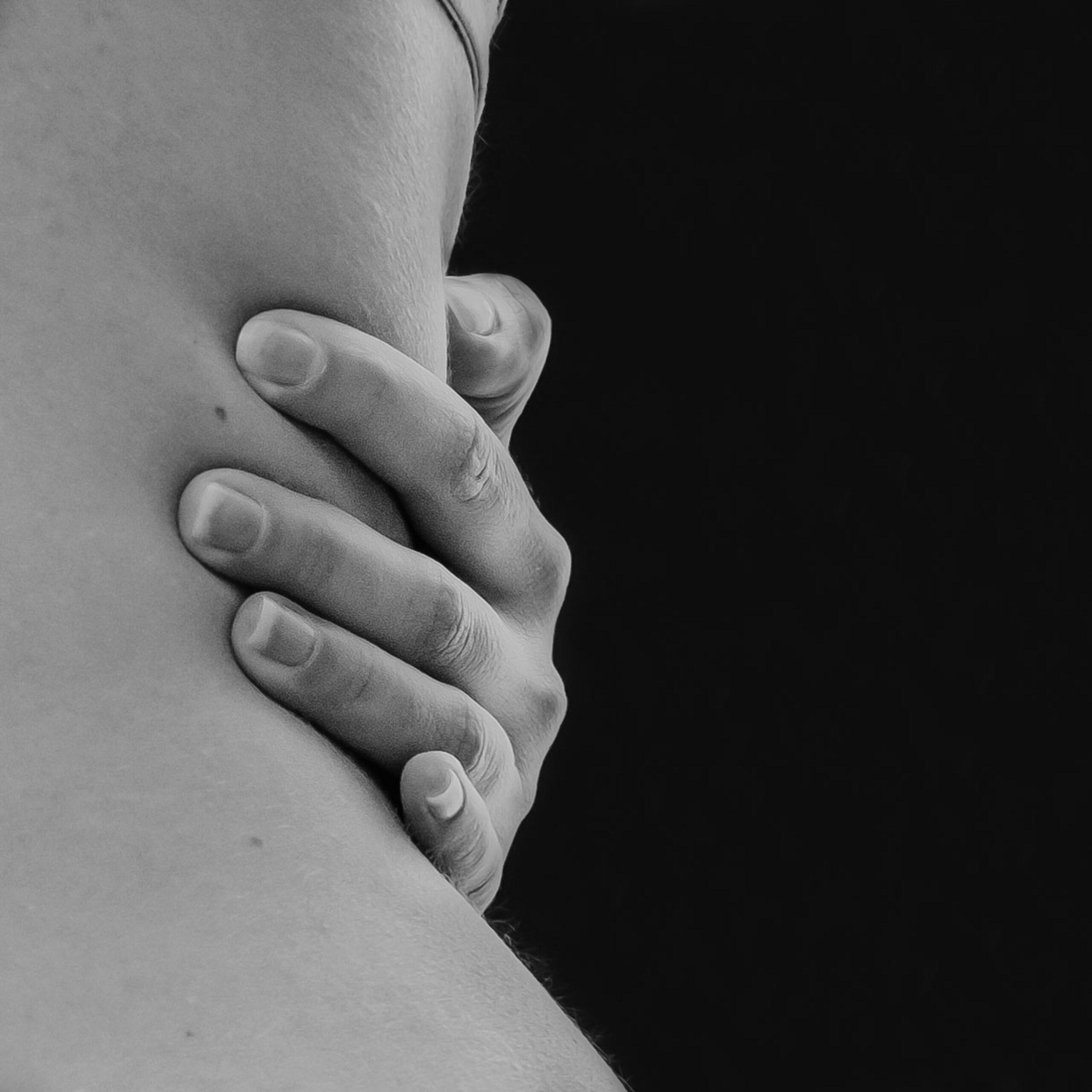 woman hugging herself